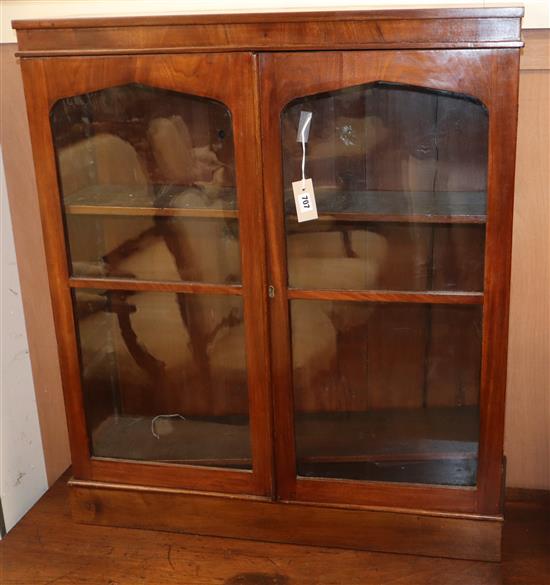 A Victorian walnut glazed bookcase W.88cm
